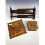 A vintage extendable wooden book trough together with a box and a wall plaque