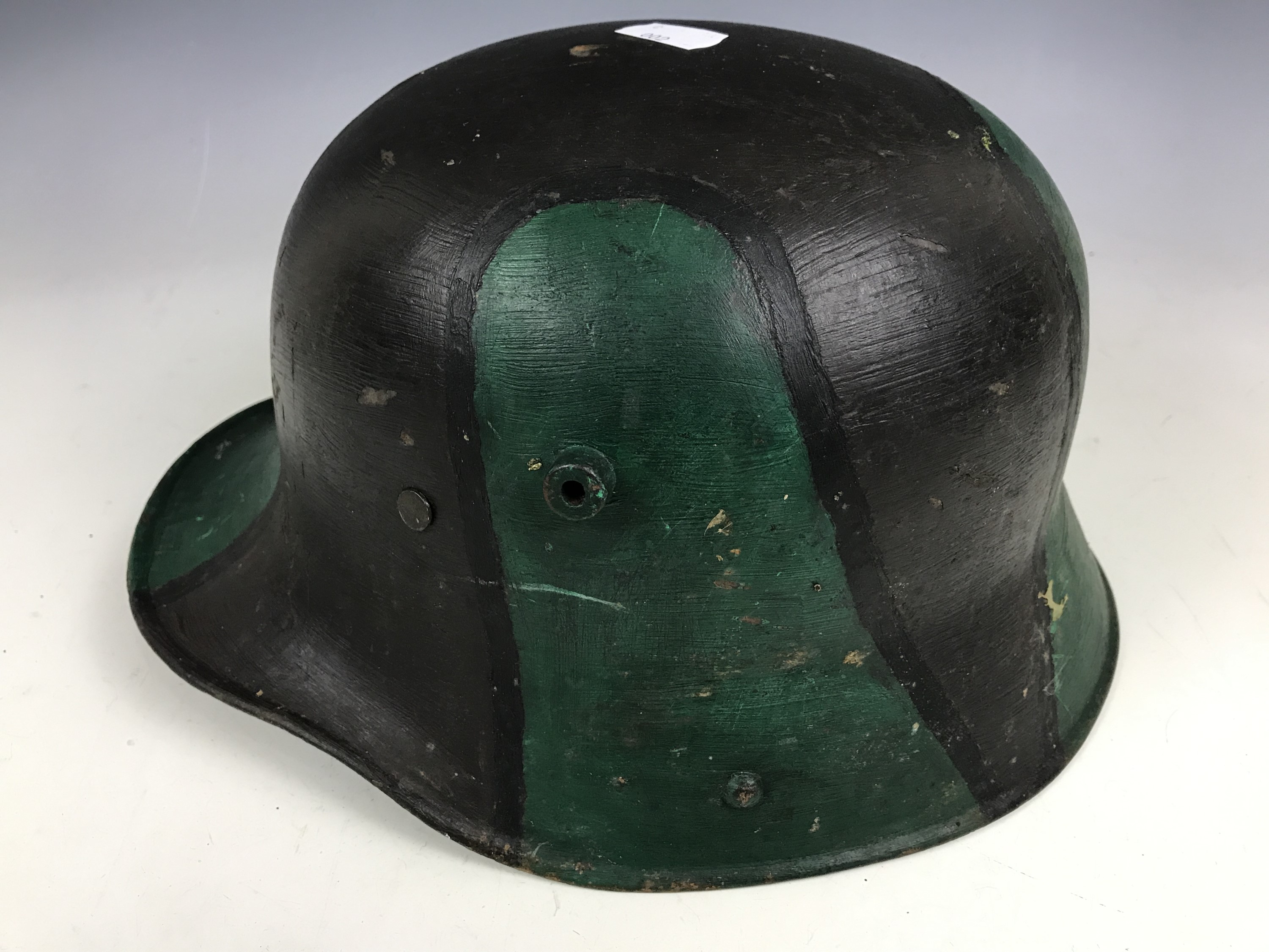 An Imperial German steel helmet, (later paint and liner) - Image 2 of 3