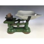 A vintage set of cast iron kitchen balance scales manufactured by J. Bowman of Carlisle