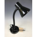 A contemporary black angle poise lamp