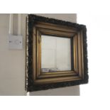 A wall mirror in Victorian fancy gilt frame