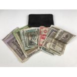 A wallet and various foreign bank notes