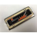 A vintage E. Hohner Echo-Lux harmonica