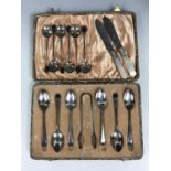 A cased set of electroplate teaspoons and sugar tongs, together with six electroplate coffee