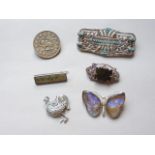 A quantity of vintage white metal brooches including a brooched silver Persian coin and an Art