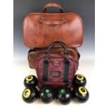 Three sets of bowling woods and bags