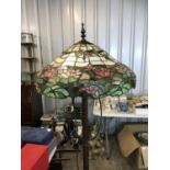 A contemporary Art Nouveau style standard lamp with two Tiffany style glass shades