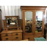 A two piece bedroom suite comprising a double wardrobe, 140 x 51 x 201 cm and a dressing table,