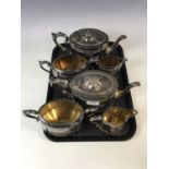 Two matching three piece electroplate tea sets