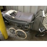 A silver cross dolls pram