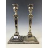 A pair of late 19th century electroplate Adams style candlesticks