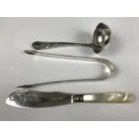 A pair of Georgian silver sugar tongs together with a Victorian silver butter knife and silver