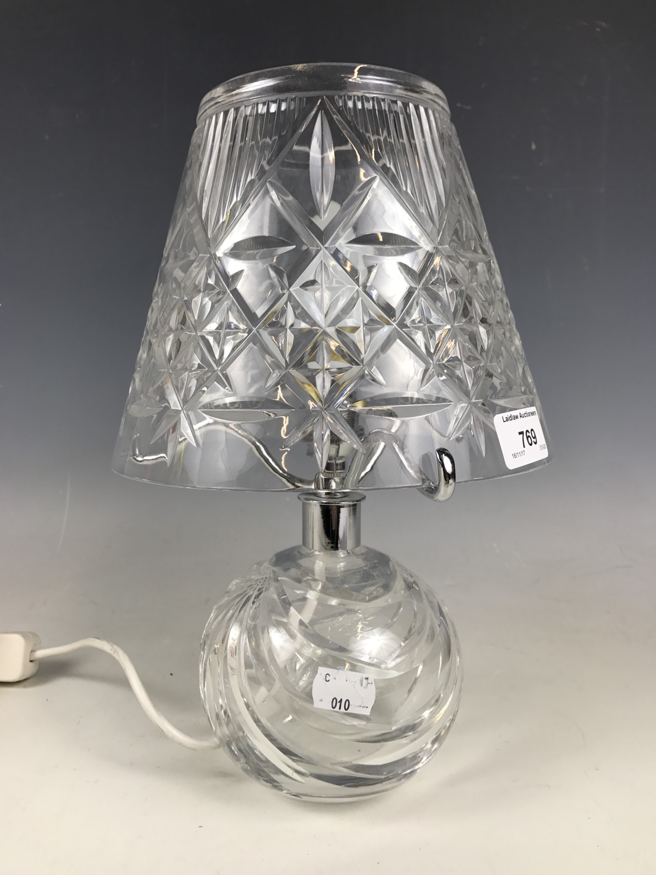 A modern cut glass table lamp and shade