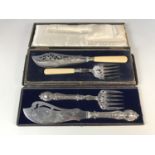 Two cased sets of electroplate fish servers