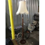 A turned mahogany standard lamp