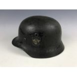 A German Model 1940 style steel helmet with Third Reich police decal, (liner post-War Norwegian)