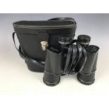 A cased pair of Plus 10 x 50 binoculars