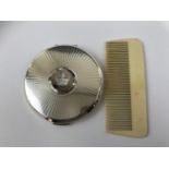 A Stratton pressed powder compact together with an early 20th Century Ivorine comb