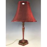 A red lacquered Chinoiserie table lamp with shade