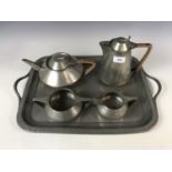 A 1920s four piece pewter tea set and tray