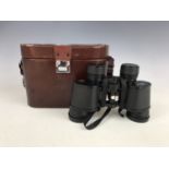 A pair of cased Nikon 10x35 binoculars