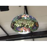 A pair of Tiffany style leaded and stained glass pendant ceiling lights, 43 cm diameter