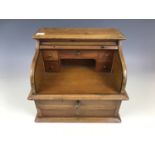 A late 19th Century miniature roll-top desk, 31 x 22 x 27 cm high