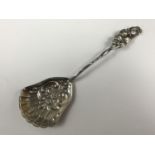 A Swedish white metal caddy spoon, with naturalistically modelled rosebud terminal and stem,