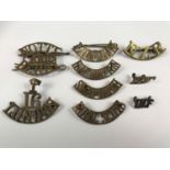 A small quantity of British and Commonwealth brass shoulder titles including T-16-LONDON