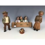 A collection of four Black Forest type novelty wood carvings, including a coat rack surmounted by