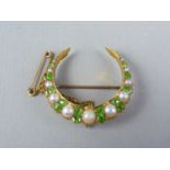 A Belle Epoch high carat yellow metal pearl and diopside crescent moon brooch