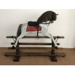 A large traditional wooden rocking horse, late 20th Century
