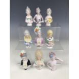 Nine large vintage continental porcelain pin-cushion ladies wearing 18th Century fashion and