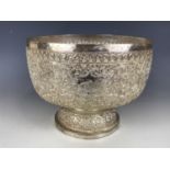 A late 19th Century Anglo-Indian white metal rose bowl, profusely and finely chased and engraved
