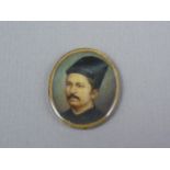 An early 20th Century portrait miniature of an Indian gentleman, watercolour over ivory, preserved