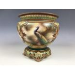 A 19th Century Royal Worcester Hadley Ware footed cachepot, hand enamelled in the round with