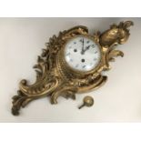 A 19th Century French Rococo style ormolu Cartel clock, having 8-day movement striking on a bell,
