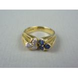 A Kutchinsky of London diamond and sapphire cocktail ring, in an organic and centrally cleft