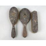 A Victorian silver dressing table mirror and brush set, comprising hand mirror, hair brush and