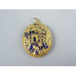 A high carat yellow metal and cobalt blue champlevé enamelled pendant locket, decorated in depiction