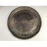 An Indian white metal circular tray, a sace / ses used to carry Zoroastrian religious or