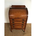 A late 19th Century Sheraton revival cross-banded and string-inlaid satinwood cylinder desk, 45 x 58