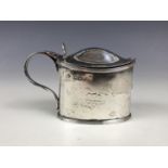 A Victorian silver mustard pot and cover, having engraved armorial crest in the form of a fox