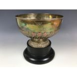 An Edwardian silver rose bowl, bearing gadrooned decoration and an engraved inscription 'Presented
