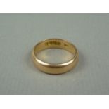 An 18ct gold wedding band, 6.4g