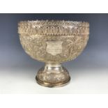An Edwardian Anglo-Indian white metal punch or rose bowl, chased and engraved in a continuous