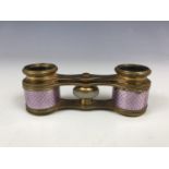 A pair of late 19th Century lilac guilloche enamelled opera glasses