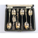 A cased set of six Edwardian silver coffee spoons, with reticulated curvilinear terminals, C T