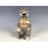 A 19th Century porcelain Darwinian nodding monkey figurine, with moving tongue, 11 cm