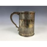 A George IV silver tankard, with reeded decoration, bearing the engraved dedication 'The gift of